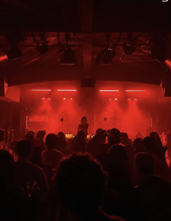Casa Nova crowd dancing under red lights in Los Angeles